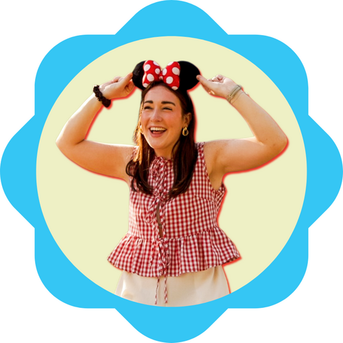 Lauren, wearing Minnie Mouse ears, laughing